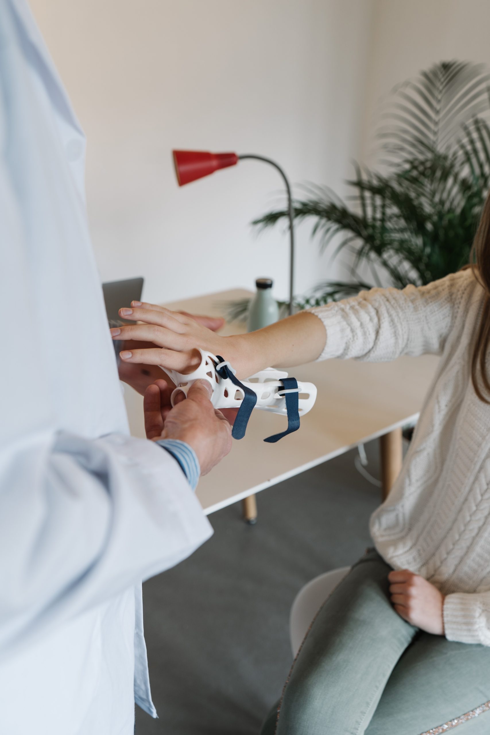 Urgent Care doctor dispensing wrist support